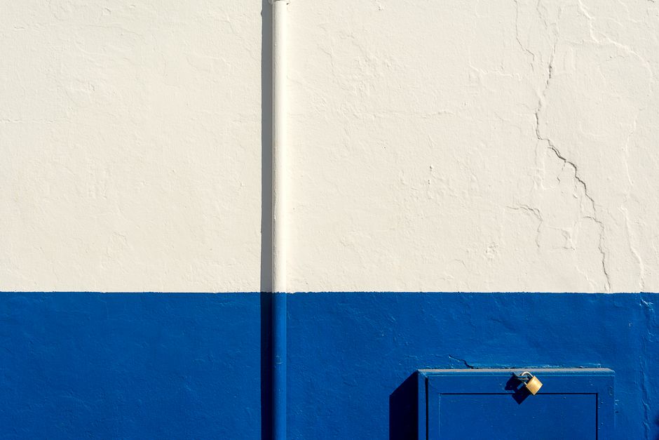 Painted wall with a bright blue and white finish